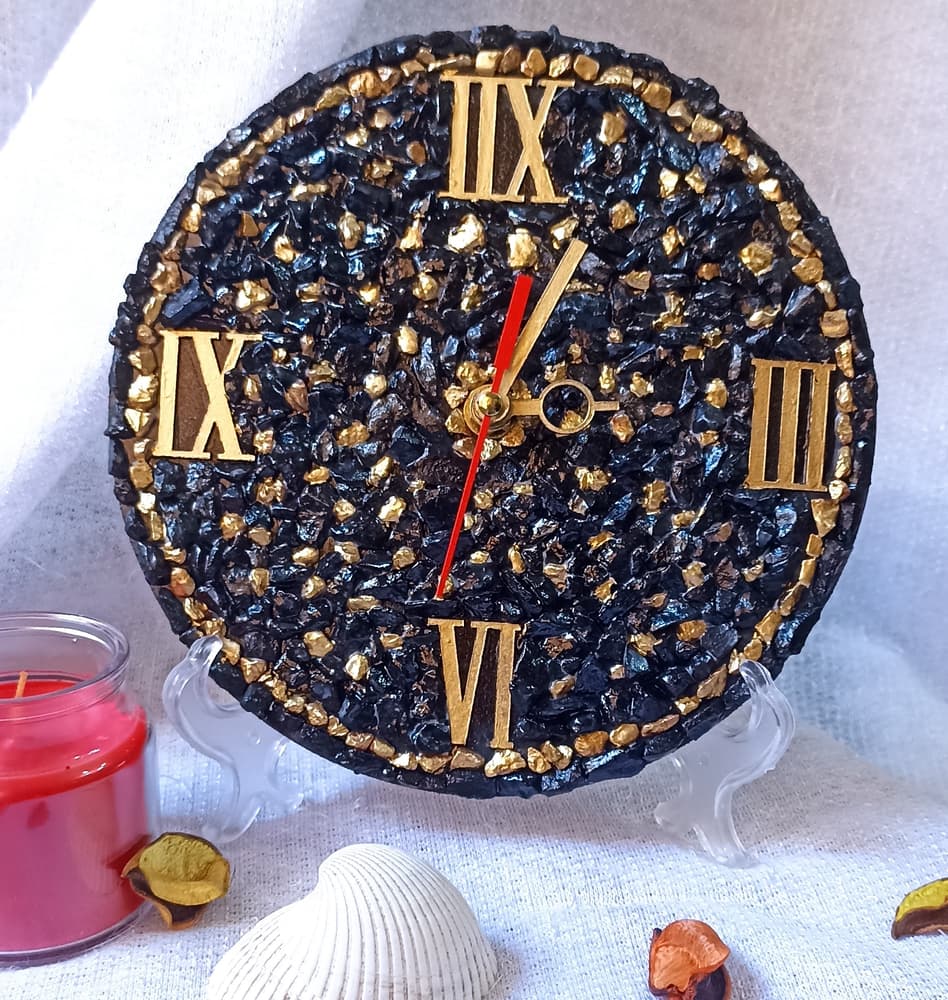 black and gold stone clock