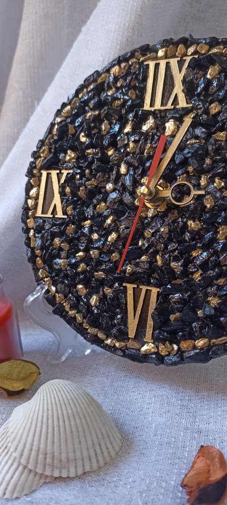 black and gold stone clock