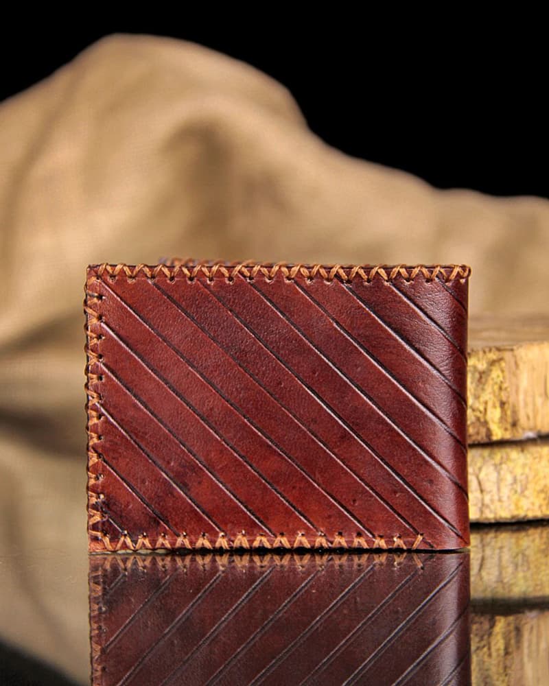 brown wallet with line carving
