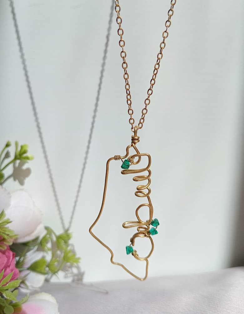 A copper chain in the shape of a map of Palestine