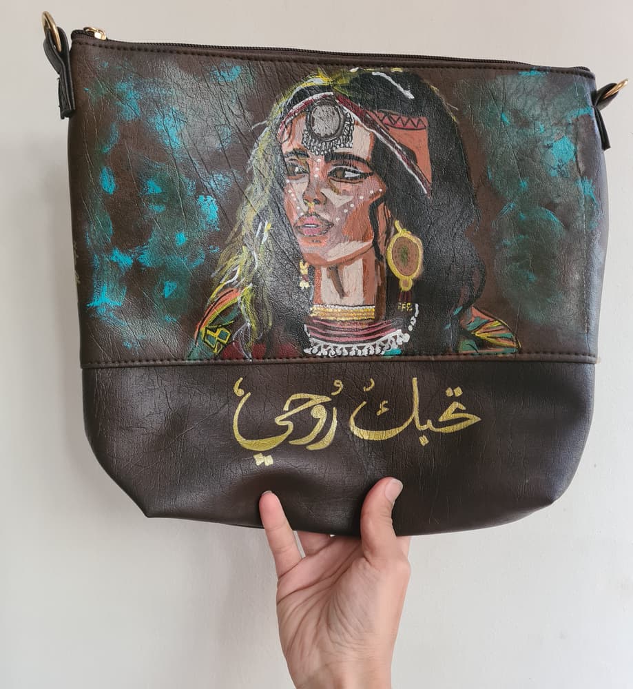 Customized handpainted Brown shades faux leather clutch with long hand included with a lady face 