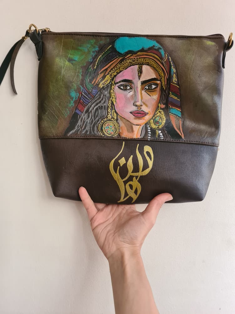 Customized handpainted Brown shades faux leather clutch with long hand included with a beautiful lady face 