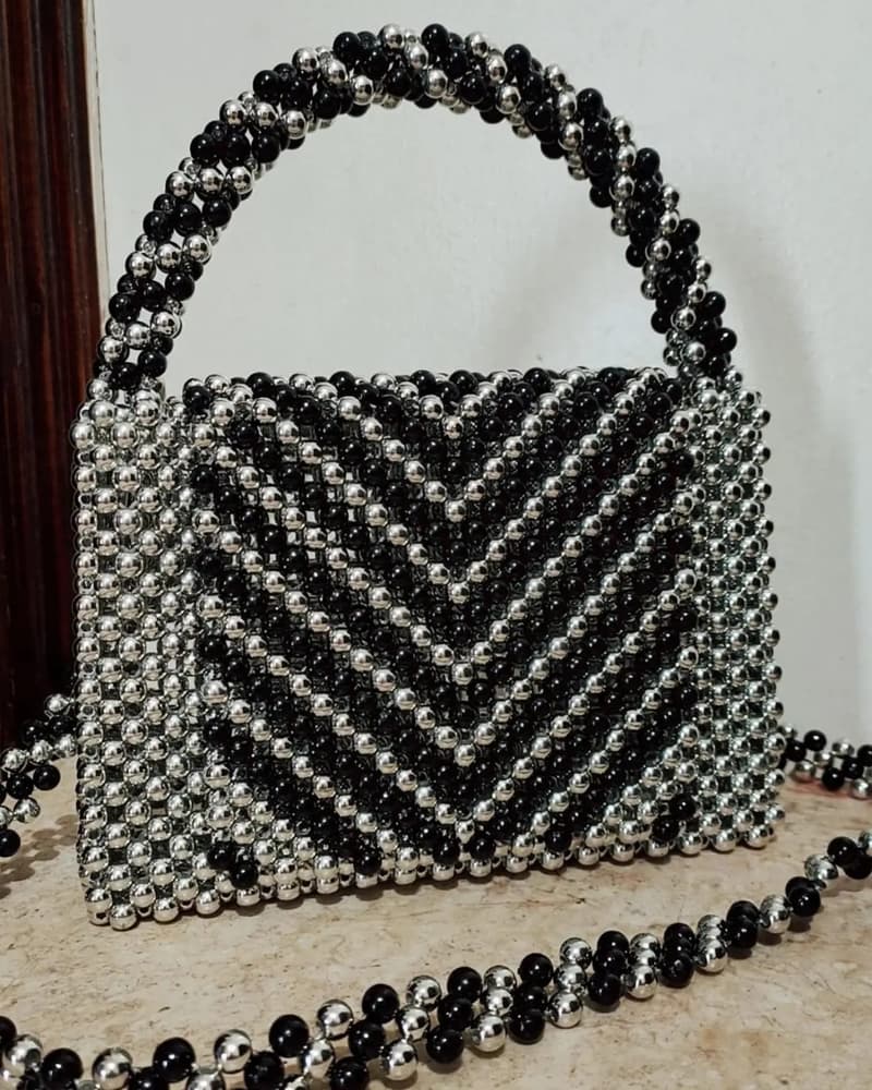 A bag of beads silver and black