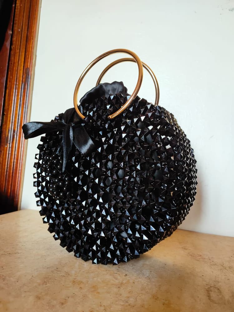 A bag of black crystal beads  