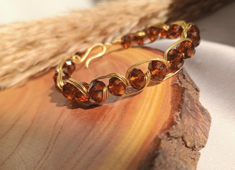 Copper bracelet with brown crystal beads