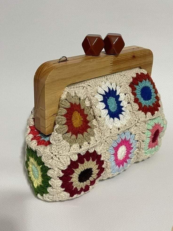 A crochet bag with a wood rim.