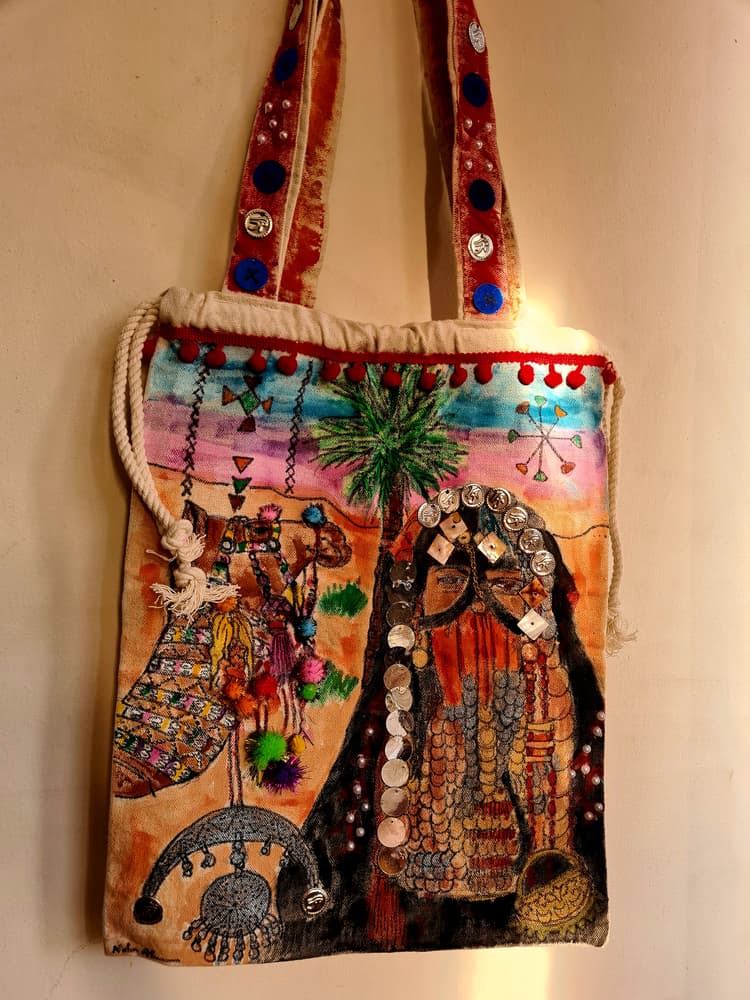Handpainted tote bag with attached accessories 