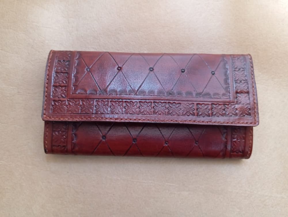 Reddish brown wallet with hand engraving