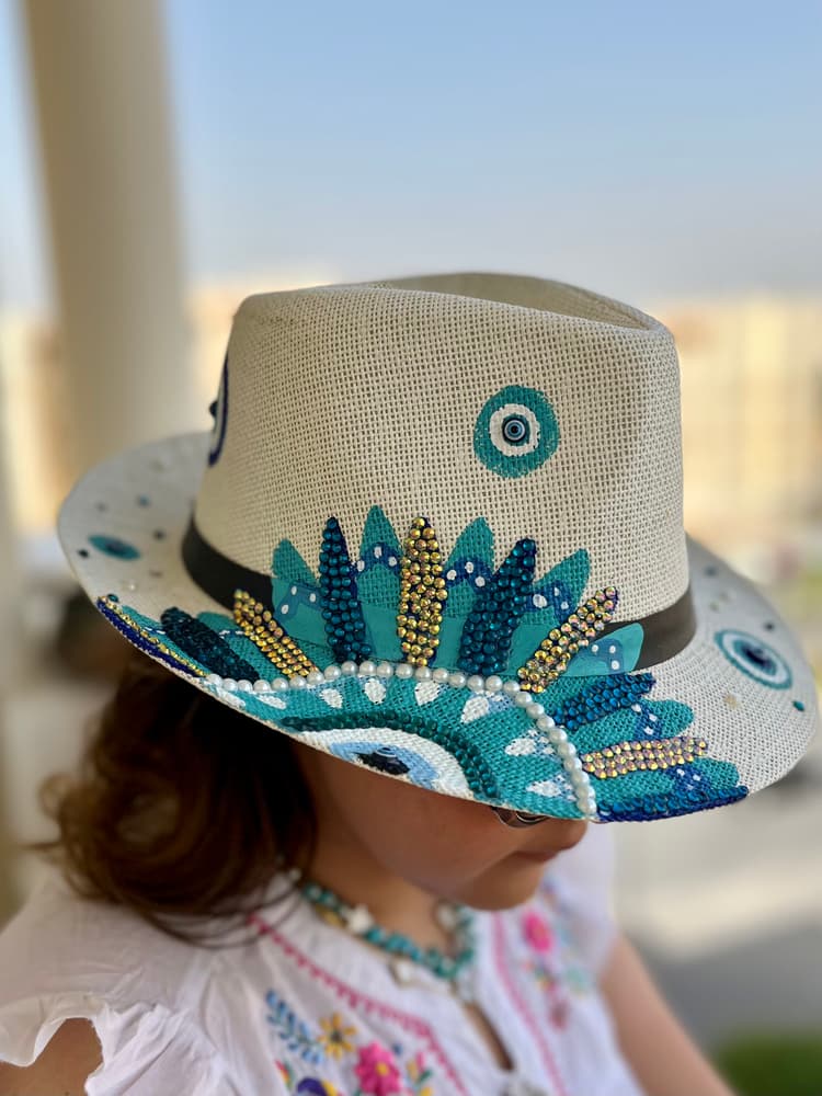 Painted turquoise flowers on hat 