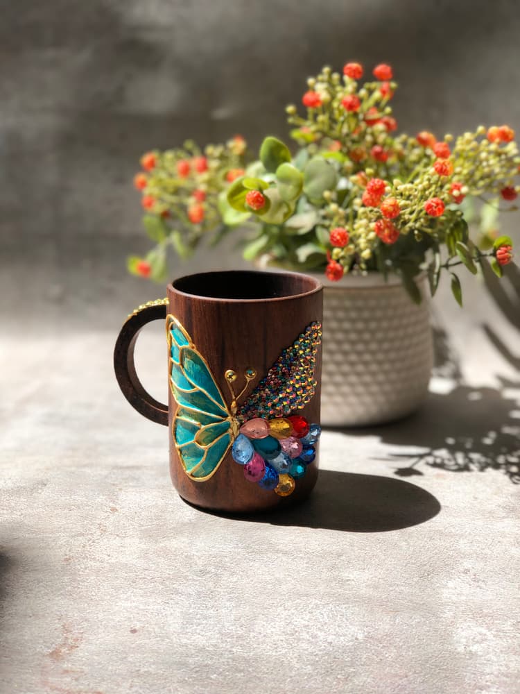 Hand painted butterfly with stones on wooden cups 