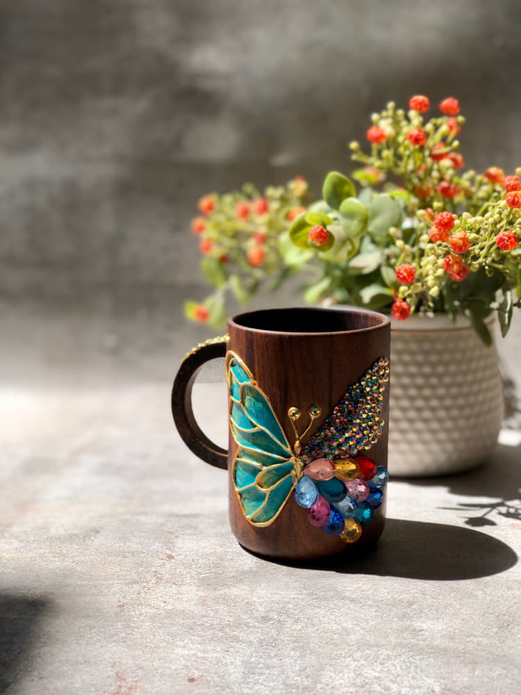 Hand painted butterfly with stones on wooden cups 