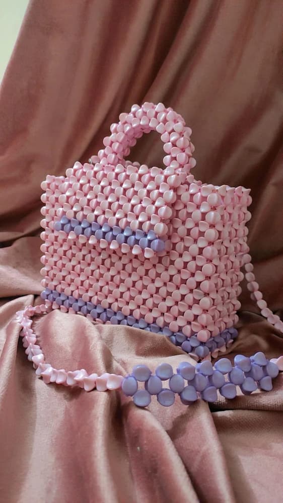 A bag of beads pink and purple 